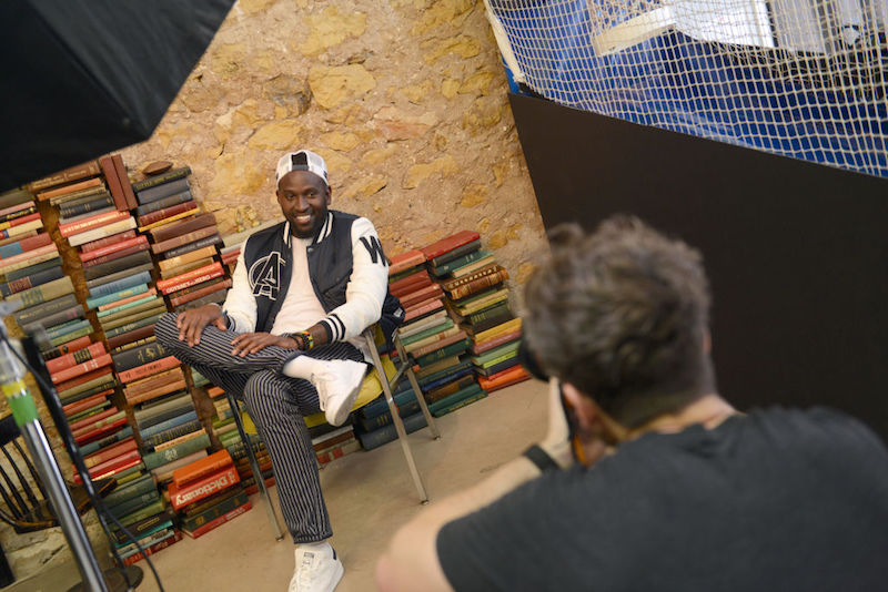 Anwan Glover sitting and posing during a photoshoot. Anwan Glover sitting and posing during a photoshoot.