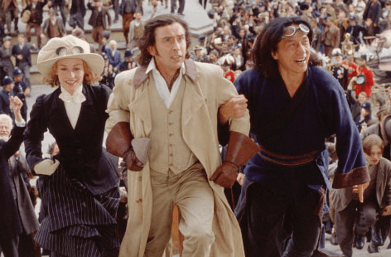 Three characters walking arm in arm in front of a large crowd. Three characters walking arm in arm in front of a large crowd.