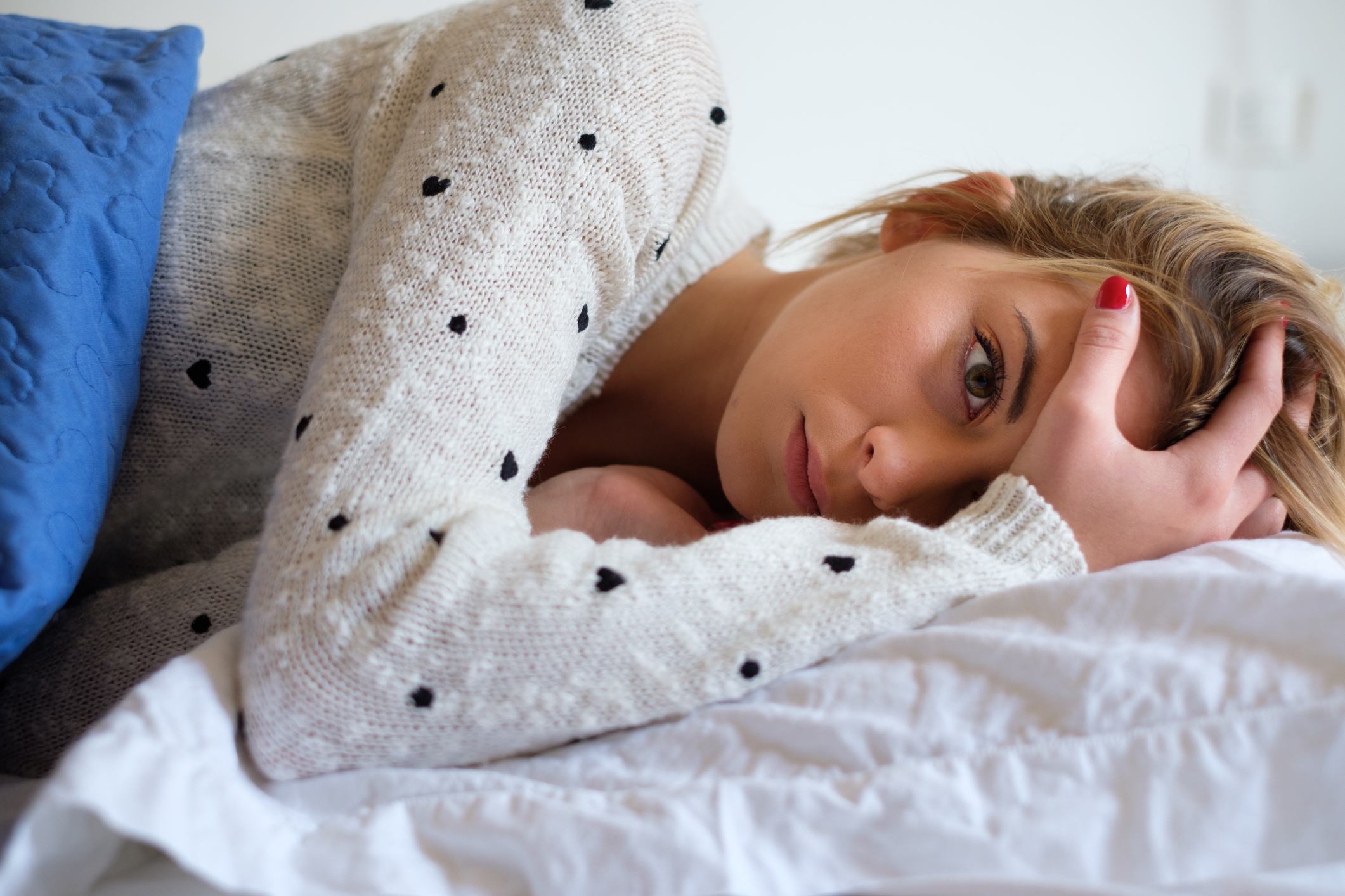 Young girl tired and lying on the bed Young girl tired and lying on the bed