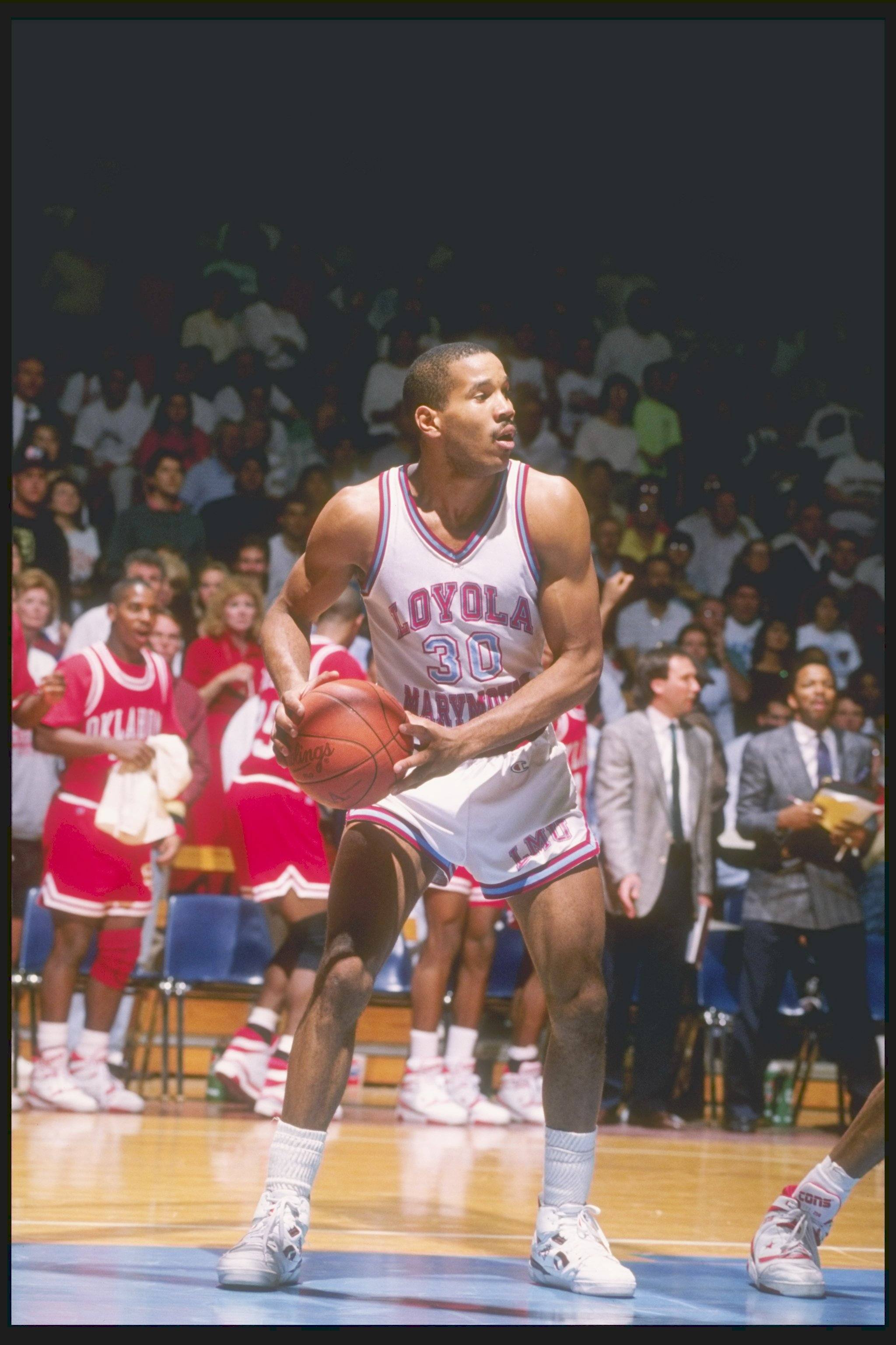 Bo Kimble of Loyola holds the ball
