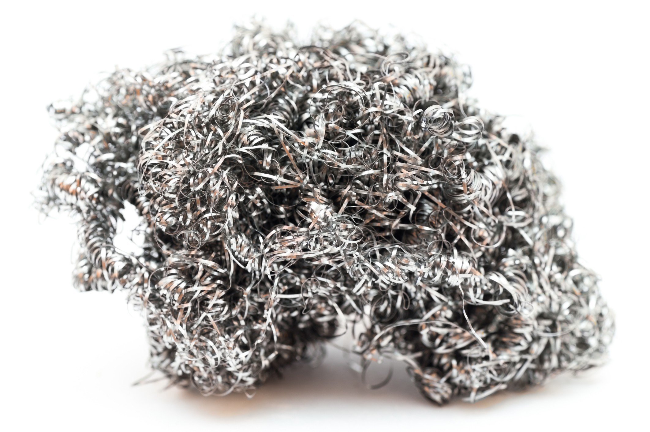 Brillo pad steel wool on white background.