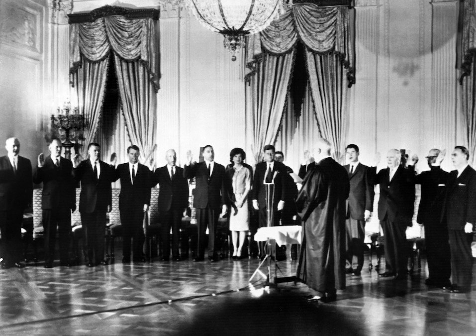 Members of the cabinet of US President John Fitzgerald Kennedy take the oath during the swearing-in of the new cabinet