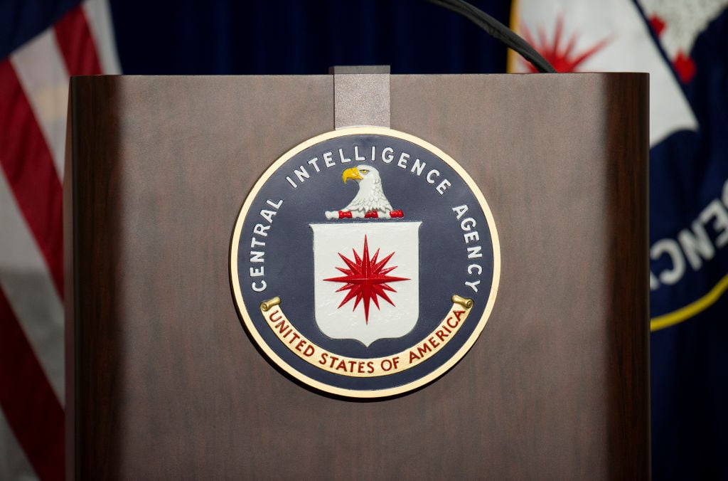 The lectern stands empty as reporters await the arrival of Director of Central Intelligence Agency