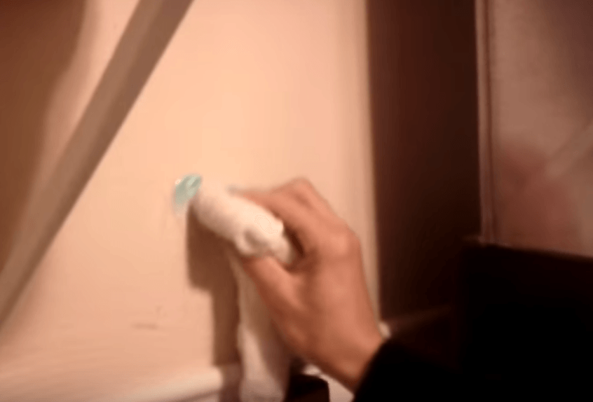 Cleaning wall with toothpaste