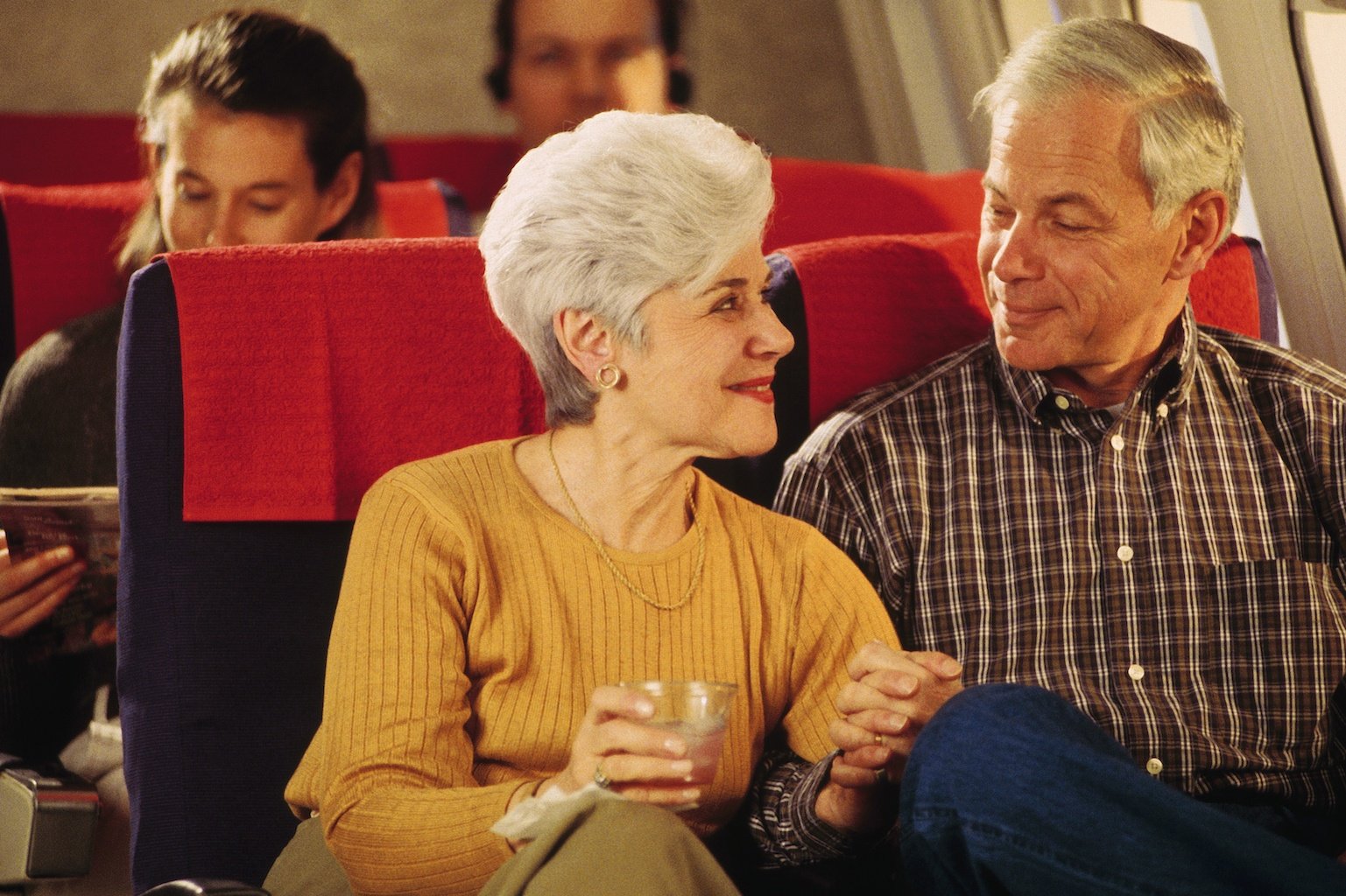 Senior Couple on airplane in the 1990s