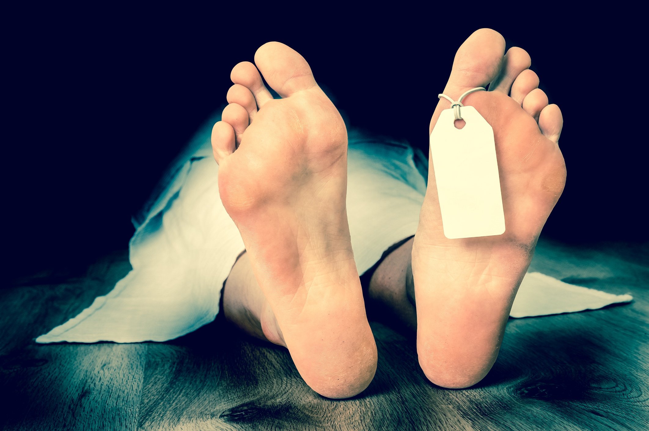 Dead woman with blank tag on feet