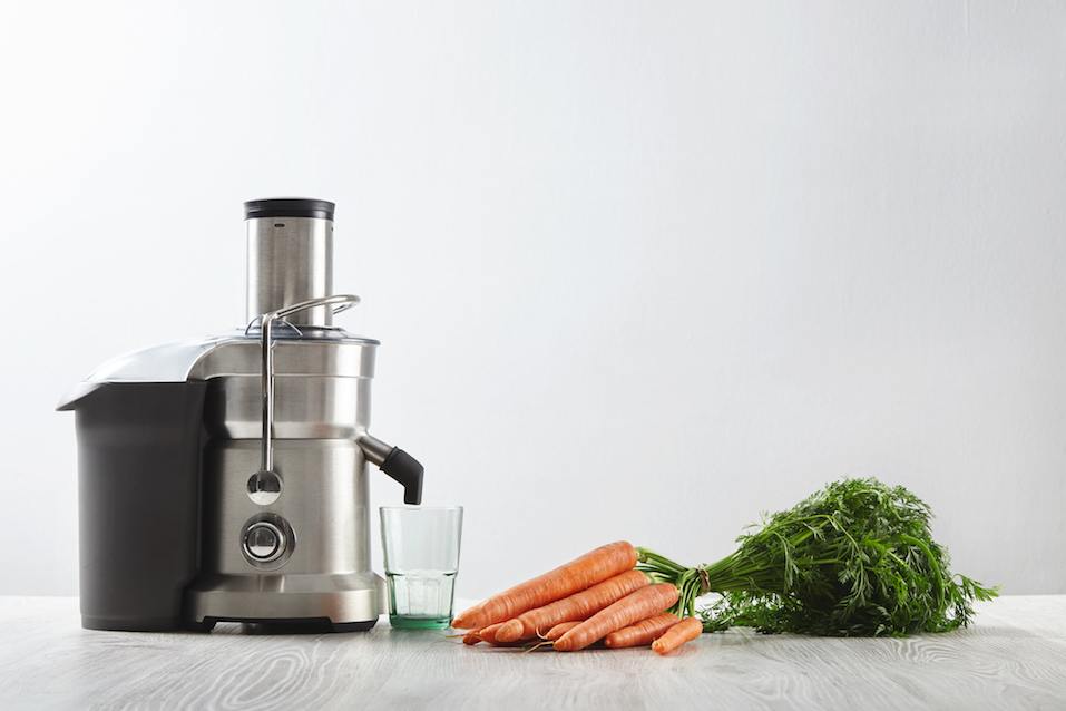Metallic professional juicer with empty glass