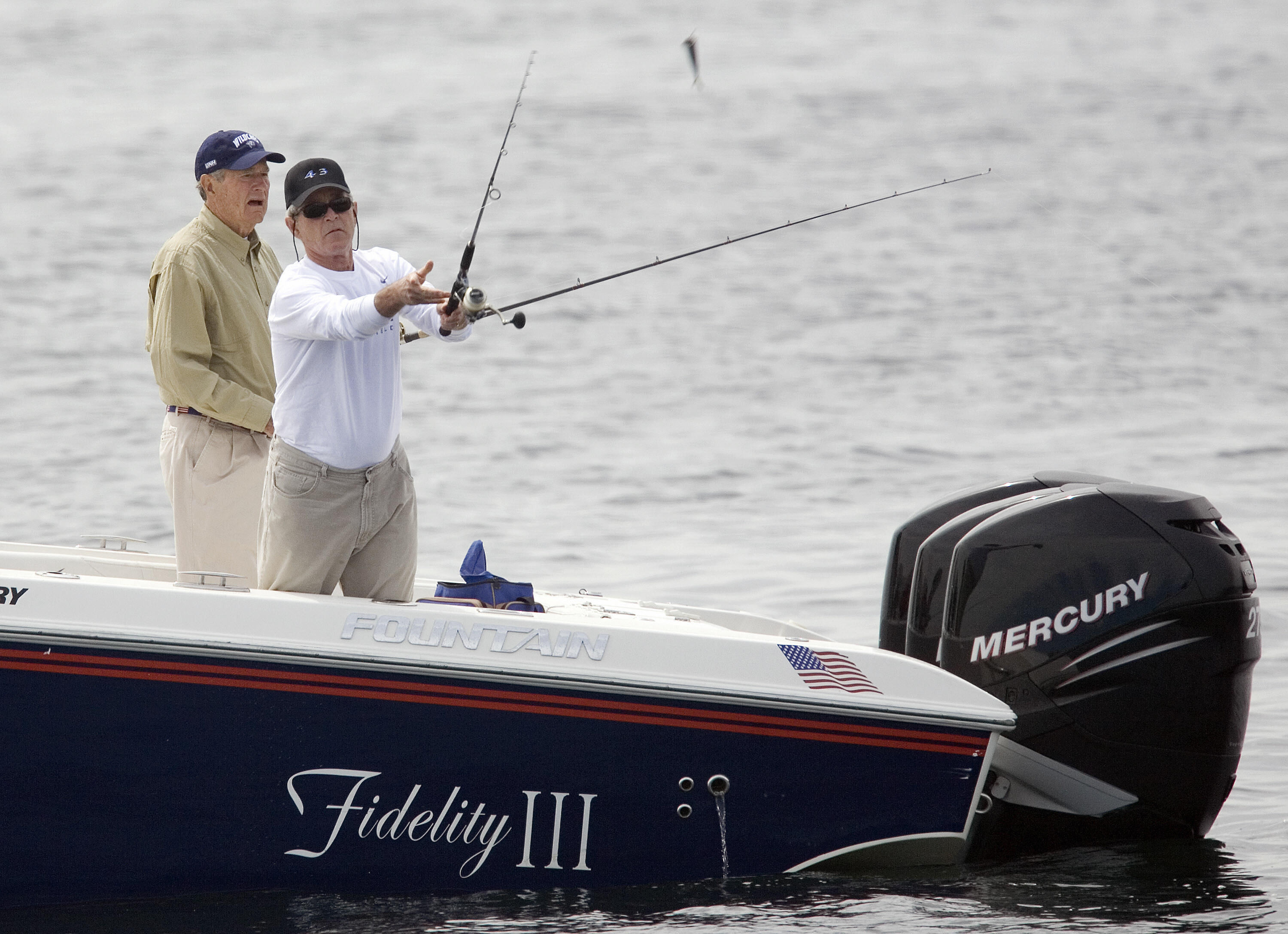 US President George W. Bush (R) and former president George HW Bush