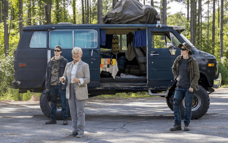 George, Mitch and Hilda in front of a blue van. George, Mitch and Hilda in front of a blue van.