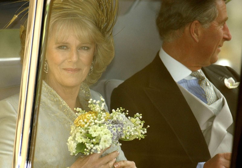 Prince Charles and Camila Parker Bowles in the backseat of a car. Prince Charles and Camila Parker Bowles in the backseat of a car.