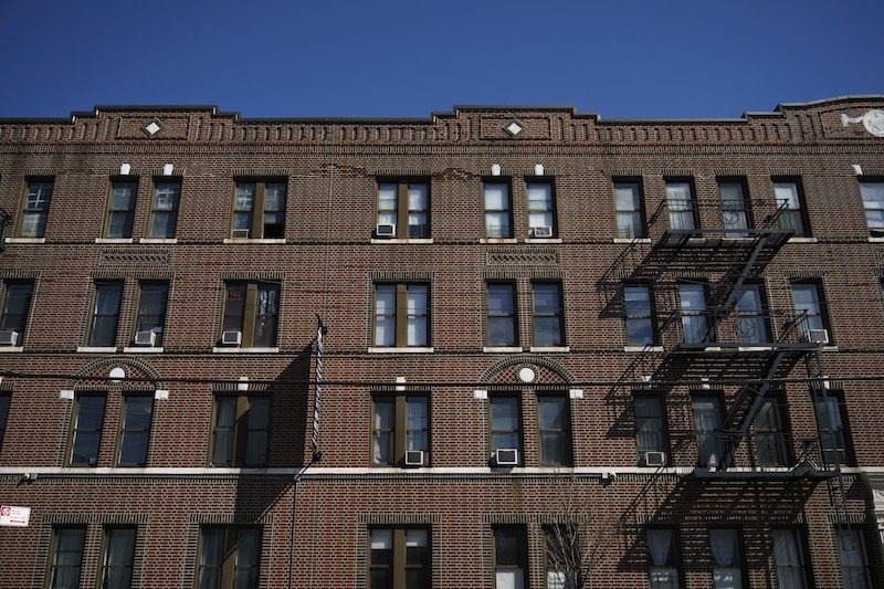 An apartment building formerly owned by the Kushner Companies, run by the family of White House senior adviser Jared Kushner, stands in the Astoria neighborhood of Queens, March 19, 2018 in New York City. In dozens of rental buildings across New York City, the Kushner Companies filed false paperwork declaring that the buildings had zero rent-regulated tenants. The move allowed the company to push out rent-controlled tenants, raise rents and boost profits when it later sold the buildings. 