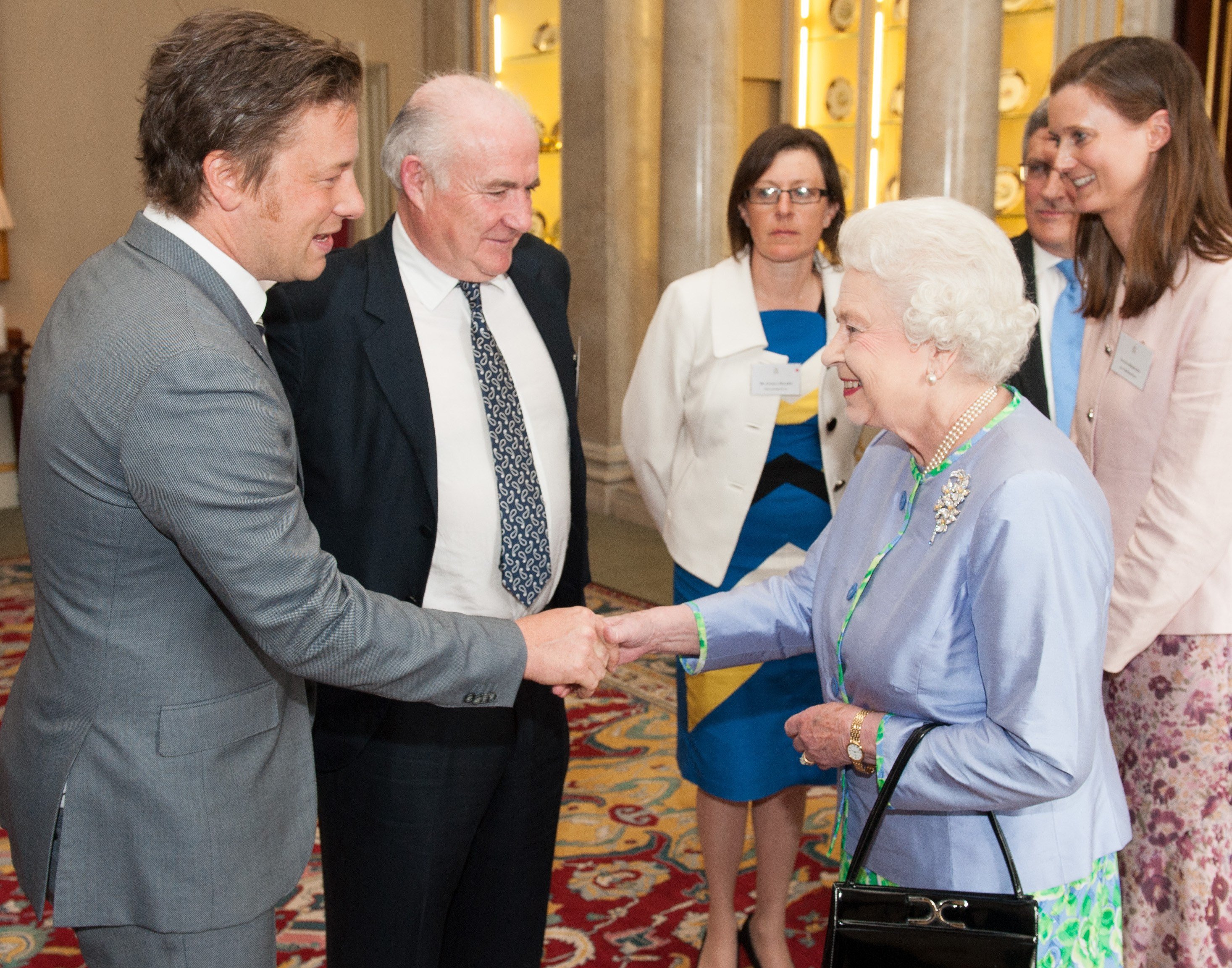 Chef Jamie Oliver shakes hands with Queen Elizabeth