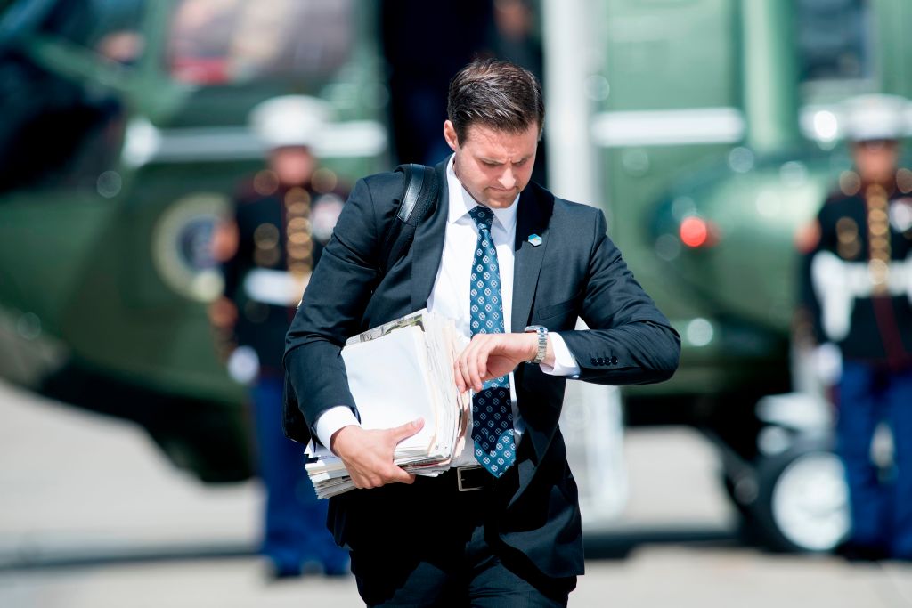 John McEntee, special assistant and personal aide follows US President Donald Trump to Air Force One