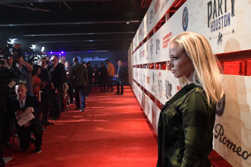 Kendra posing on a red carpet. Kendra posing on a red carpet.