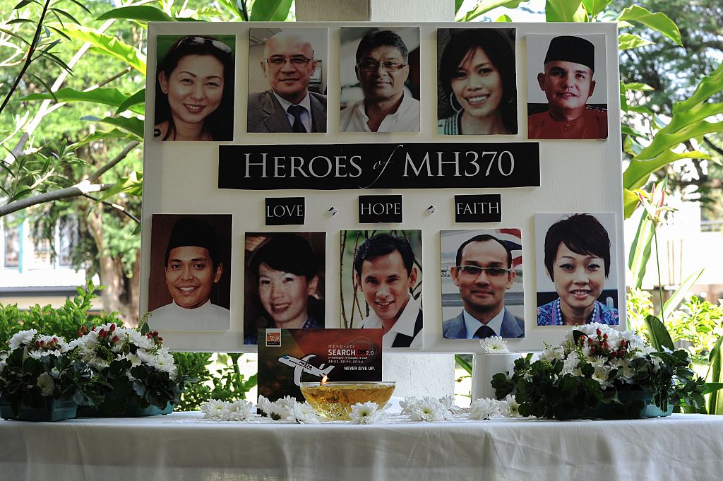 A poster showing cabin crew from missing Malaysia Airlines flight