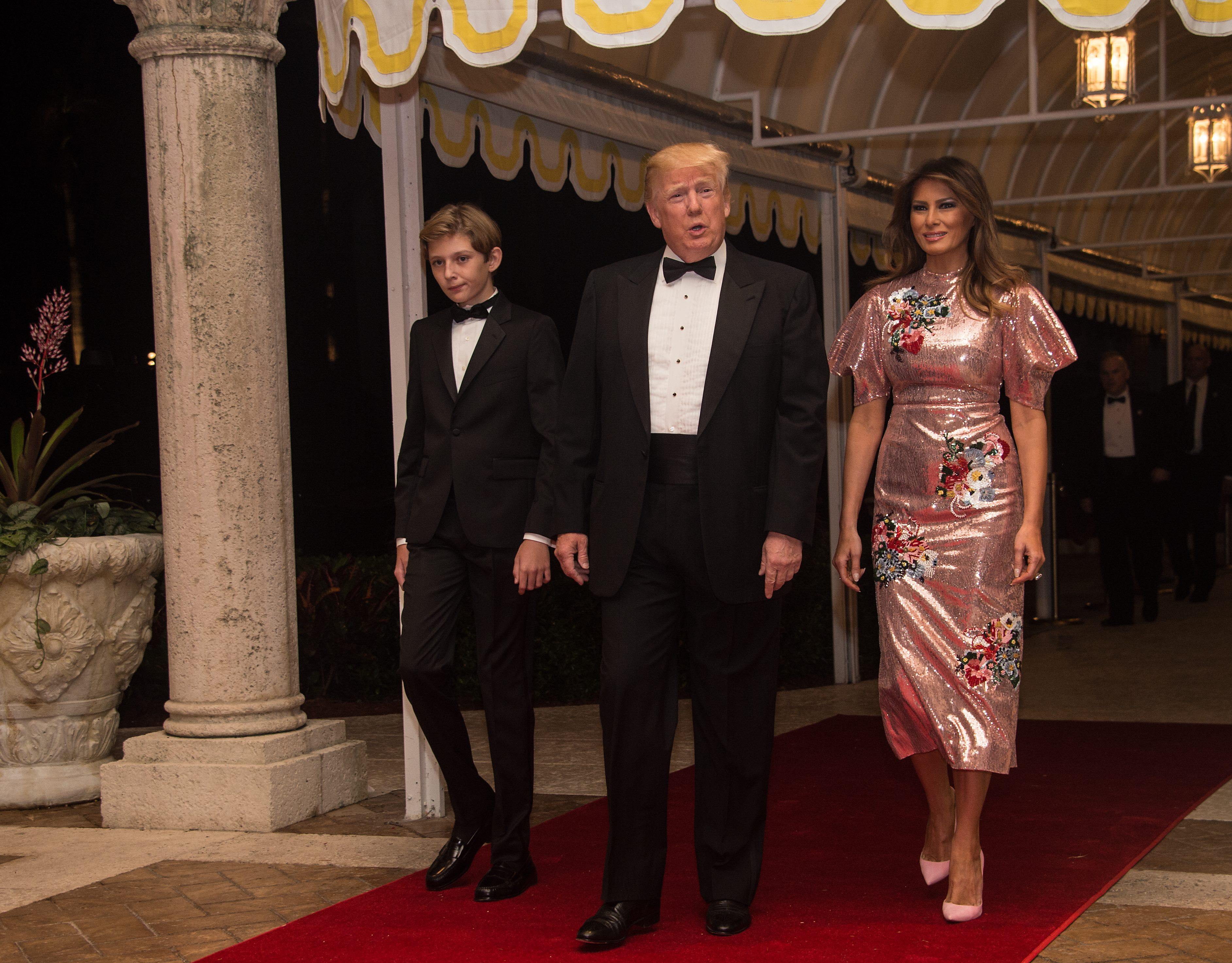 US President Donald Trump properties, First Lady Melania Trump and their son Barron arrive for a new year's party at Trump's Mar-a-Lago resort