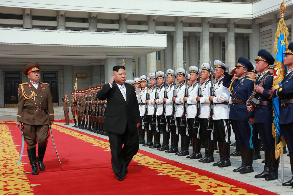 Kim Jong Un with guards