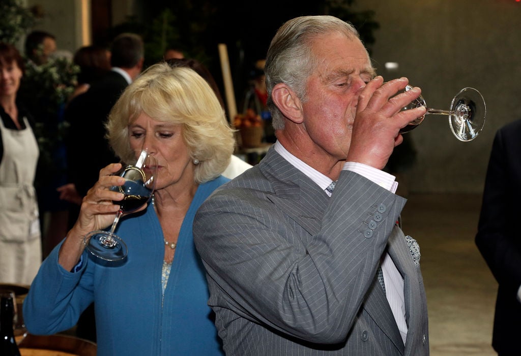 Britain's Prince Charles and his wife Camilla, Duchess of Cornwall taste local wine
