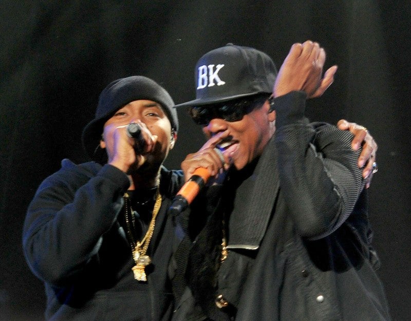 Rappers Nas and Jay-Z performing on stage. 