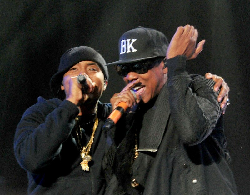 Rappers Nas and Jay-Z performing on stage. Rappers Nas and Jay-Z performing on stage.