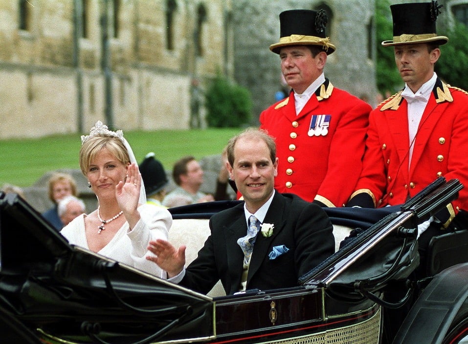 Newly-wed British royal couple Prince Edward and Sophie Rhys-Jones wave to wellwishers as their carriage leaves Windsor Castle
