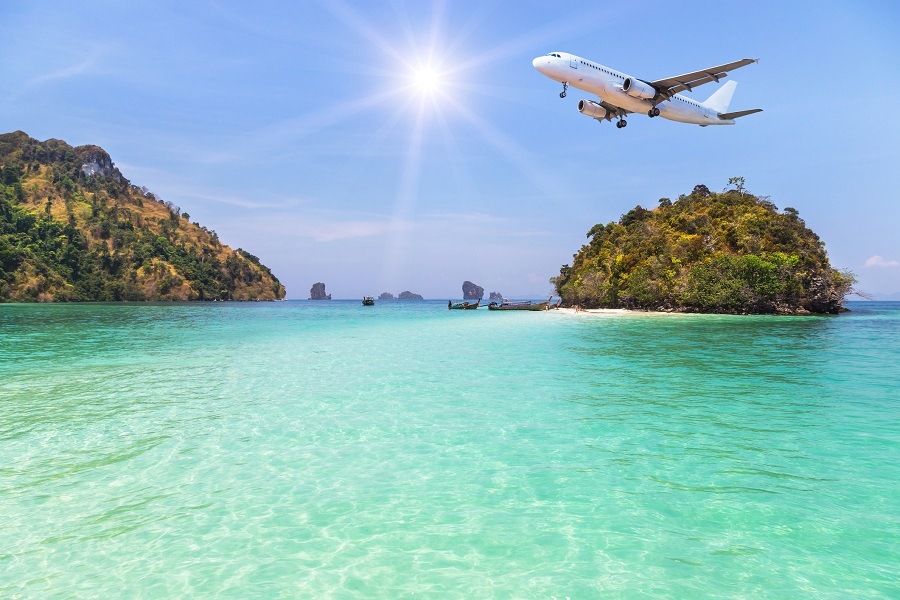 passenger airplane landing above small island passenger airplane landing above small island