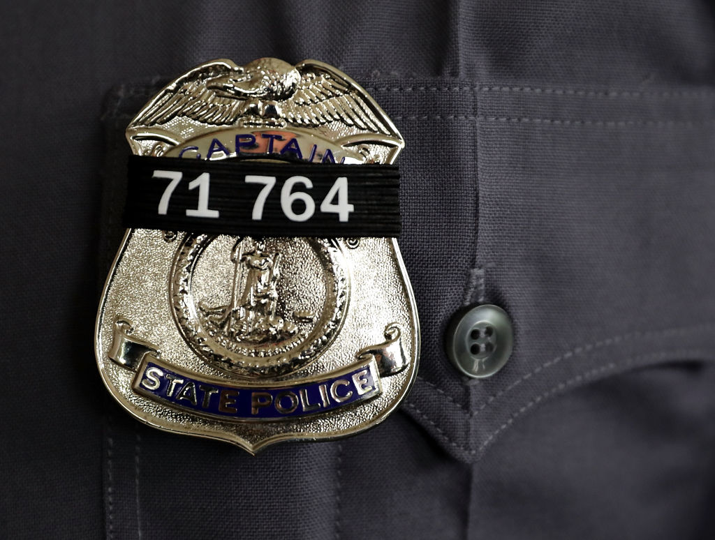 A black band with the badge number of Virginia State Police