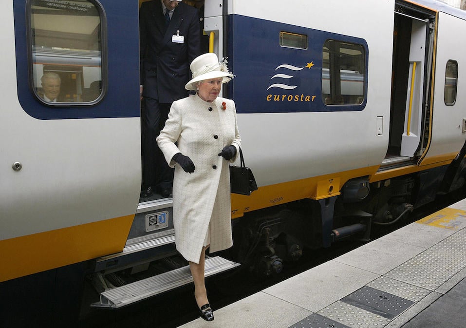 Queen Elizabeth II steps out of a Eurostar train as she arrives at the Gare du Nord station