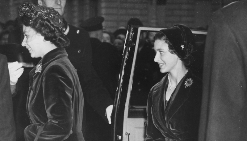 Princess Margaret walking behind Princess Elizabeth. 