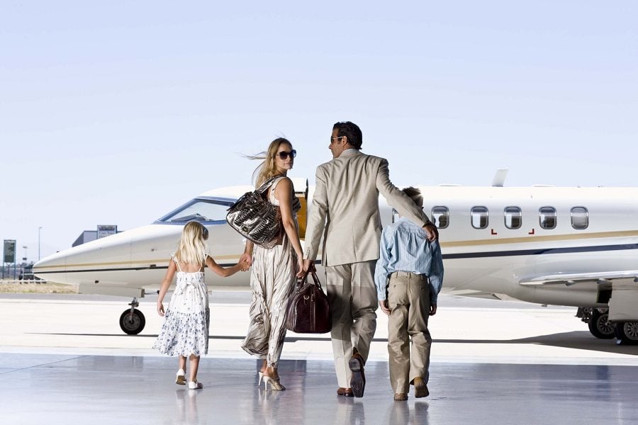 A well-dressed family ready to board a plane A well-dressed family ready to board a plane