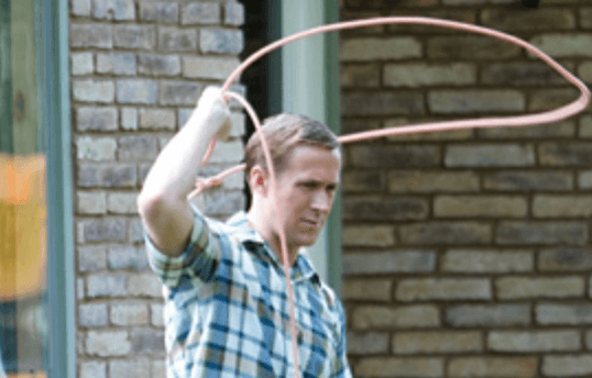 Ryan Gosling swinging a rope in 'First Man'. Ryan Gosling swinging a rope in 'First Man'.