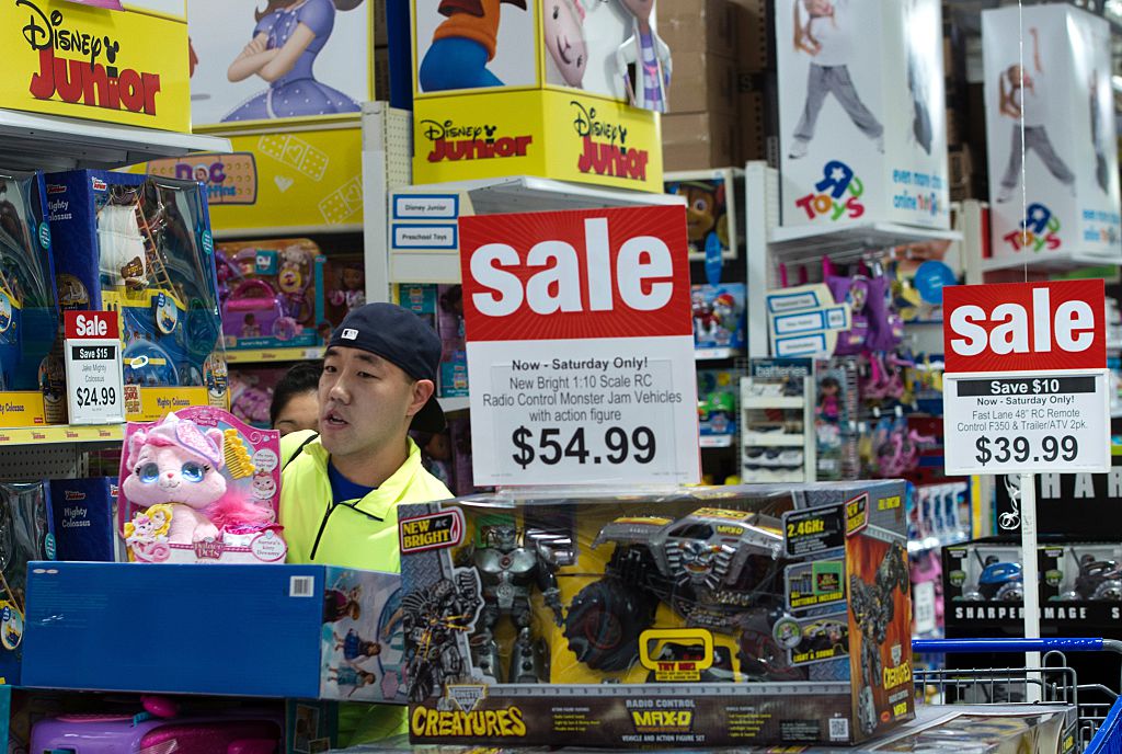 Customer walking near toys on sale