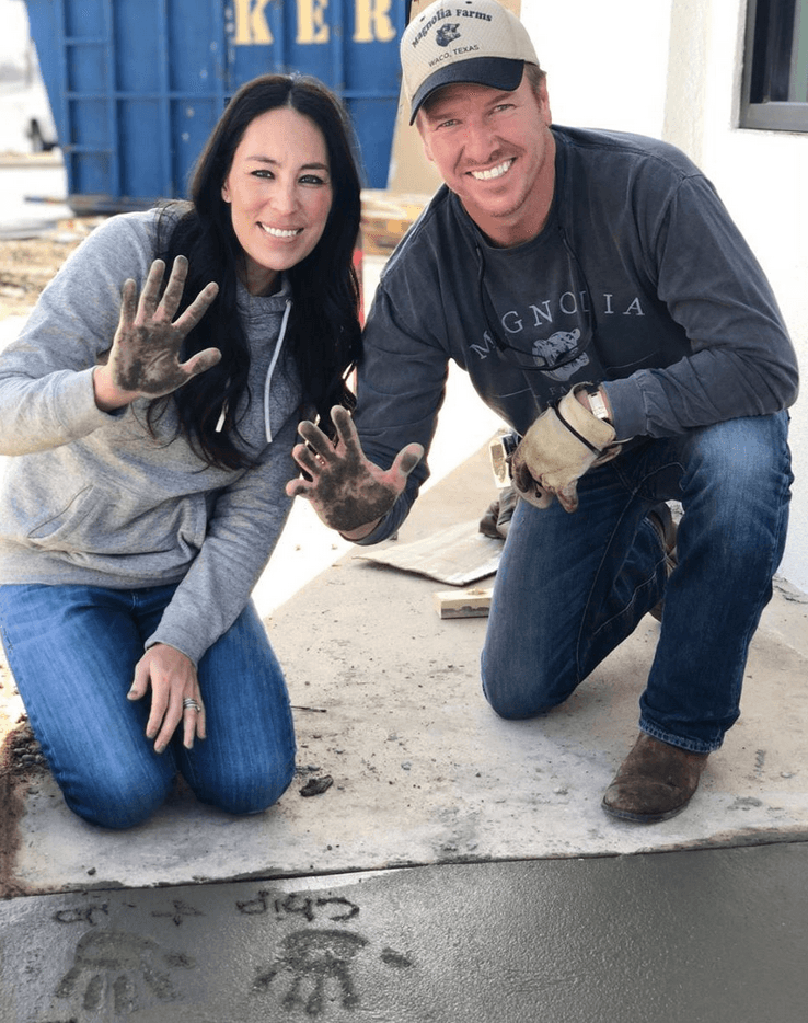 Chip and Joanna making handprints