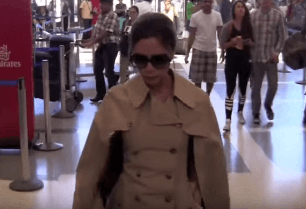 Victoria Beckham in a cape style jacket. Victoria Beckham in a cape style jacket.