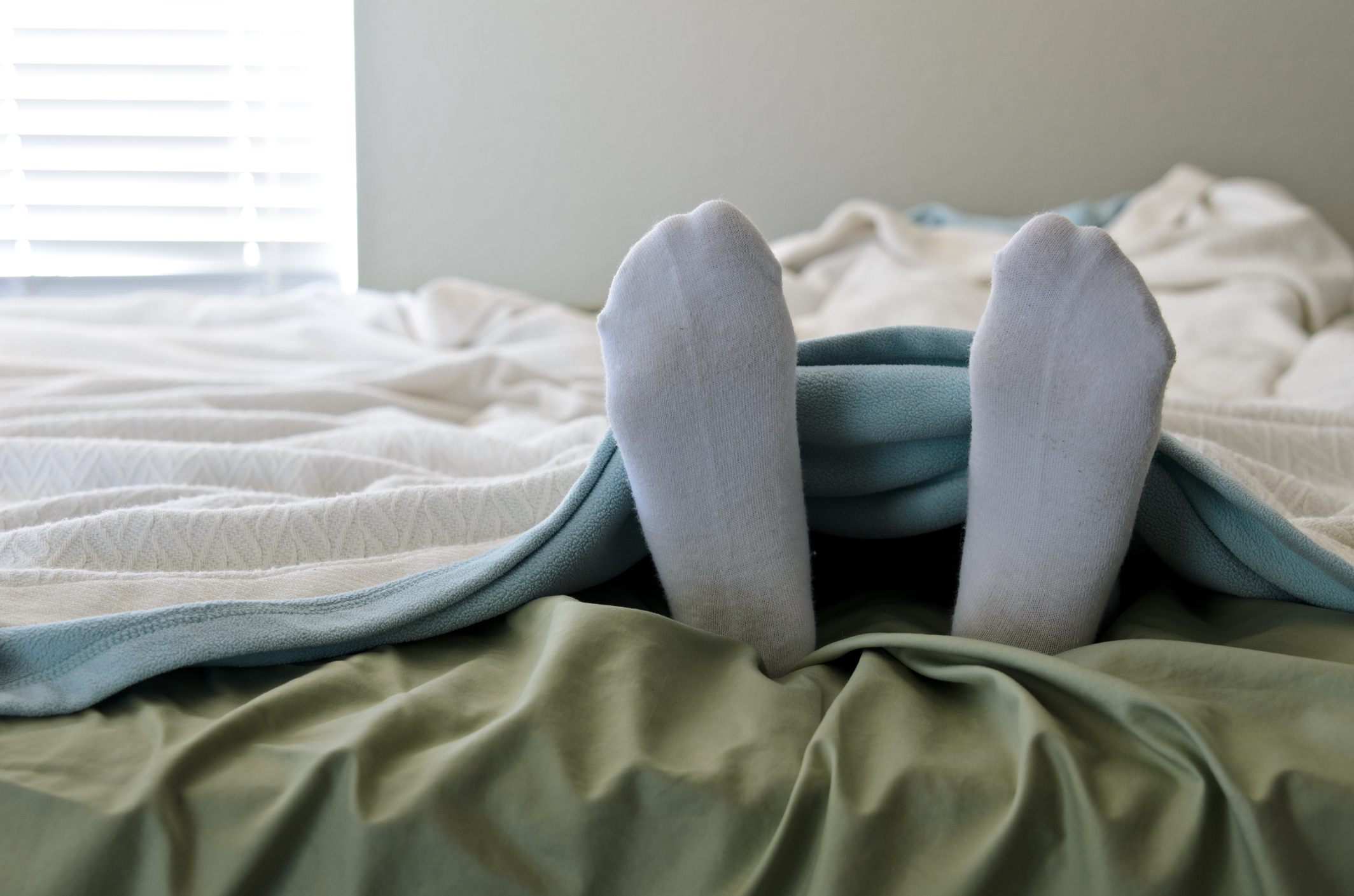 in bed with socks in bed with socks