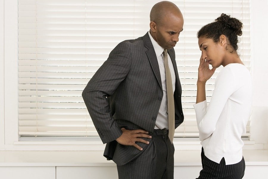 Man and wife arguing with hand on hip Man and wife arguing with hand on hip