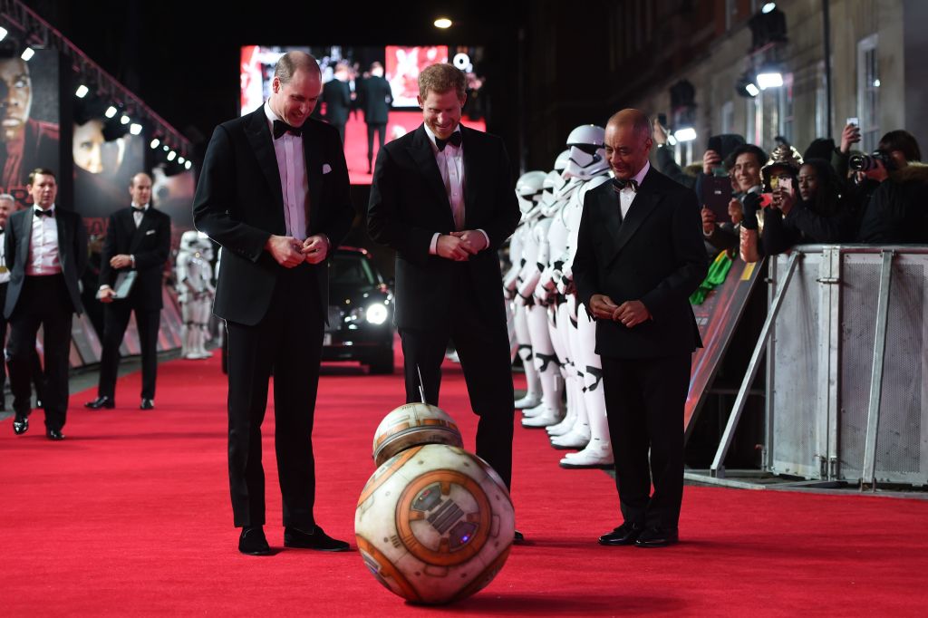 Britain's Prince William Duke of Cambridge and Prince Harry are greeted by droid BB-8 as they arrive for the European Premiere of Star Wars