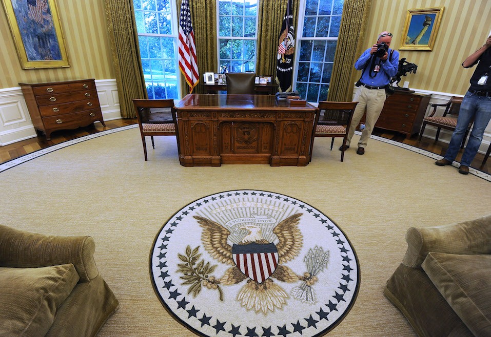 The Oval Office of the White House with redecorations of its carpet, couches and wallpaper.