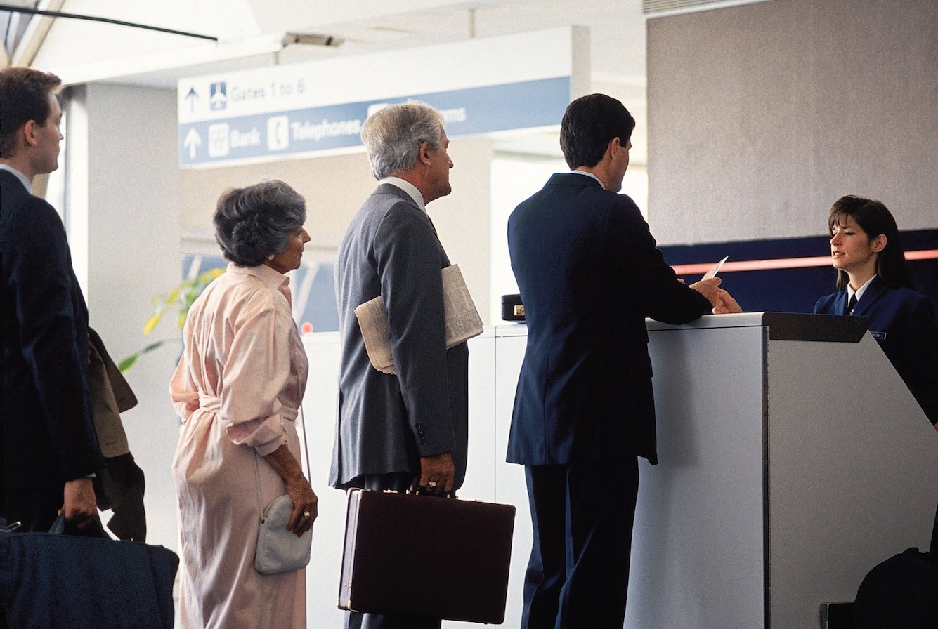 Travelers boarding an airplane