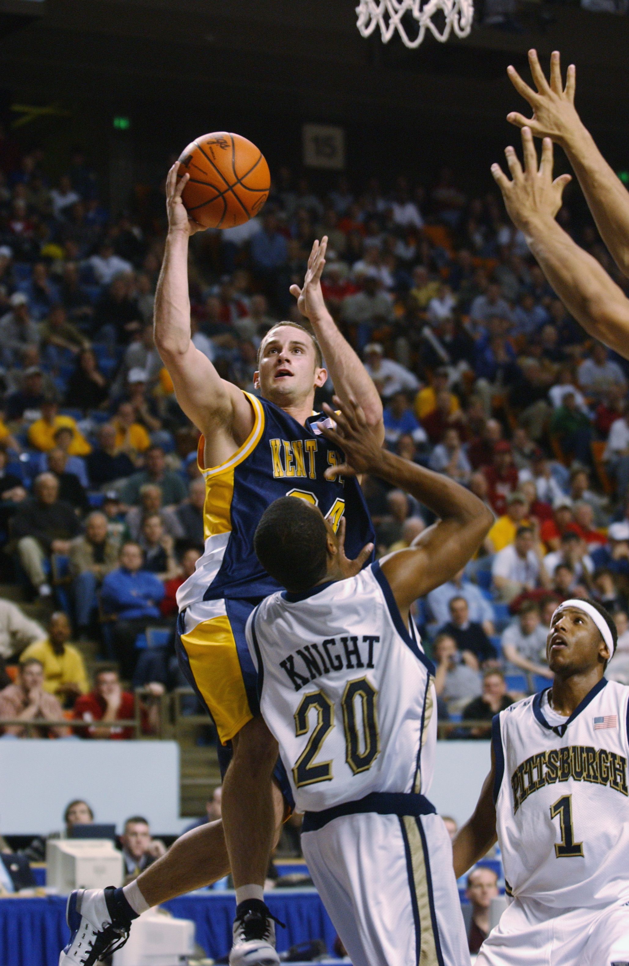 Trevor Huffman goes to basket over Knight