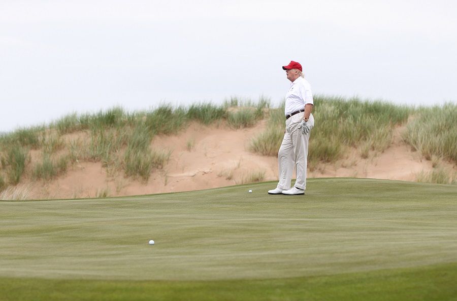 Donald Trump plays a round of golf