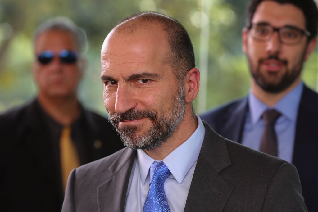UBER's CEO Dara Khosrowshahi (R) smile