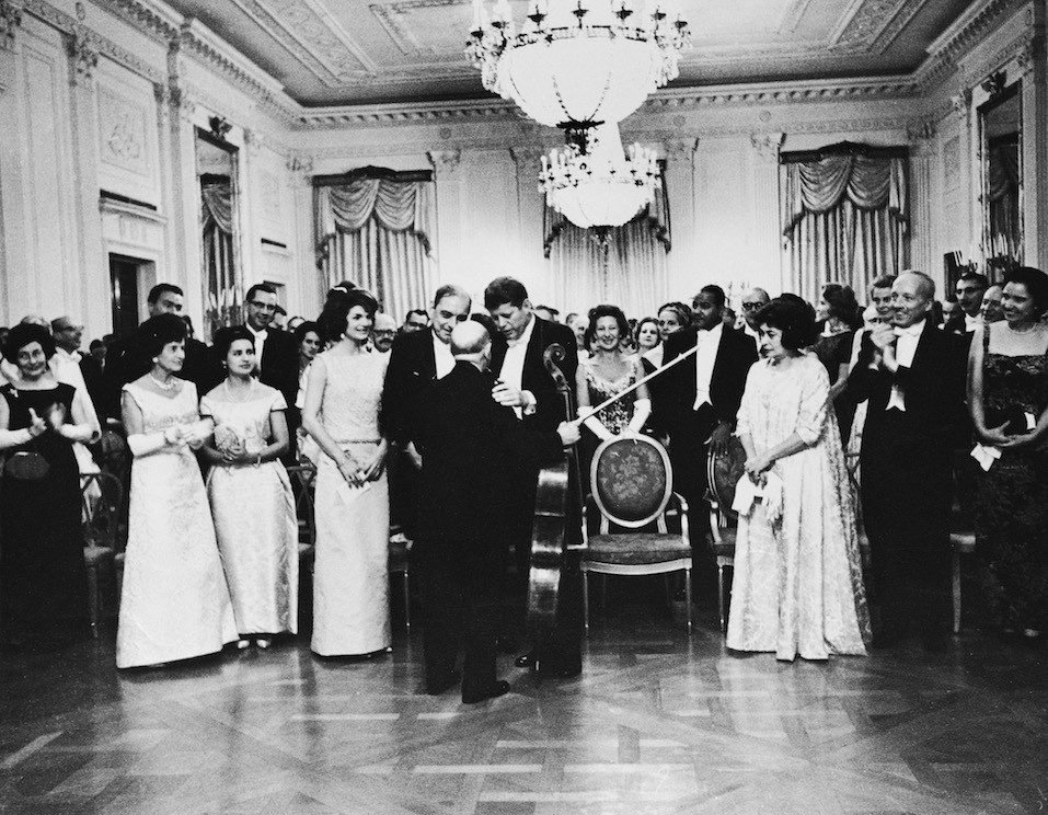 American president John F. Kennedy (1917 - 1963) and his wife Jackie congratulate Spanish cellist Pablo Casals