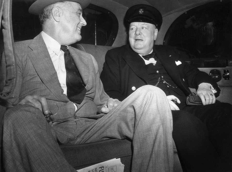 British Prime Minister Winston Leonard Spencer Churchill with Franklin Delano Roosevelt seated in a car on their way to the White House