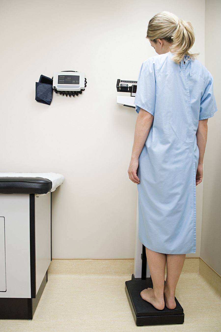 Woman checking weight Woman checking weight