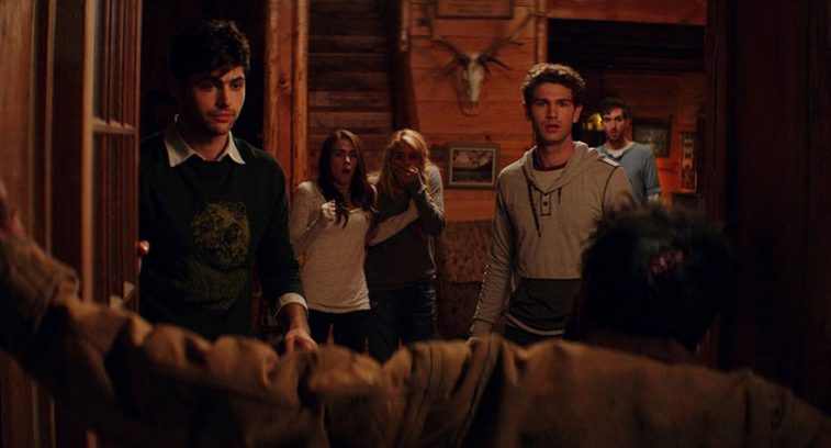 A group of people stand in a cabin