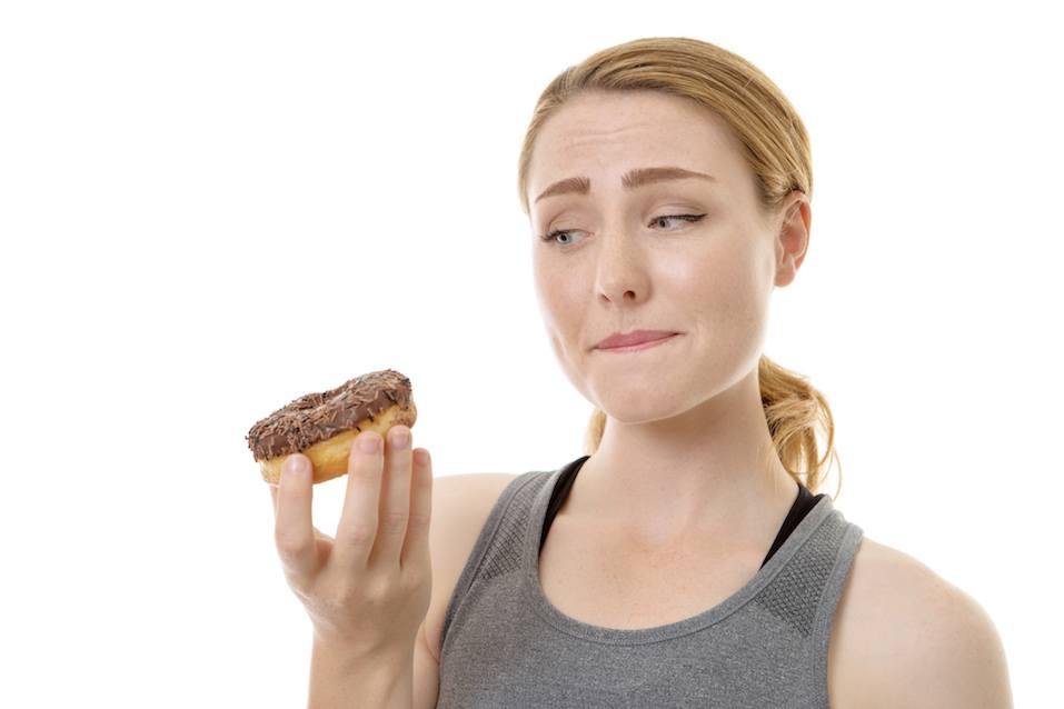 woman holding a doughnut