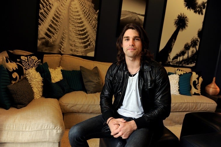 Musician Justin Gaston poses at the "If I Can Dream" house tour and cast meet and greet at a private home in the Hollywood Hills on March 1, 2010 in Los Angeles, California.