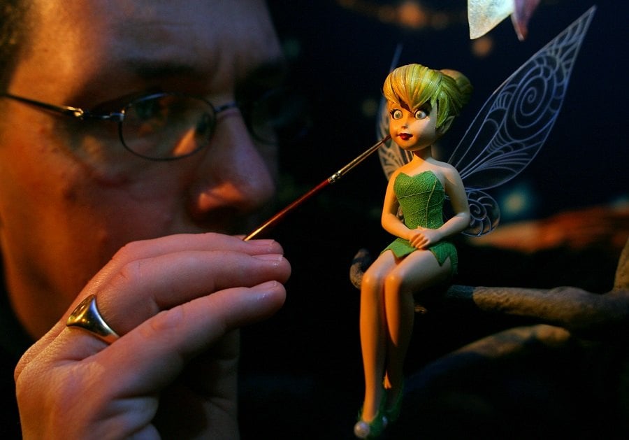 Sculptor Steven Mansfield arranges a fairy model