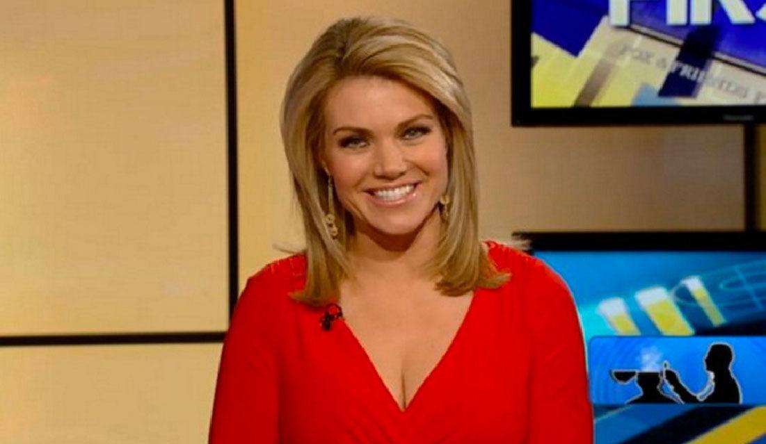 Heather Nauert smiles in a red shirt